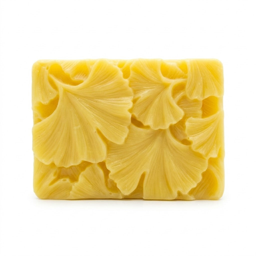 Yellow floral soap bar on a white background