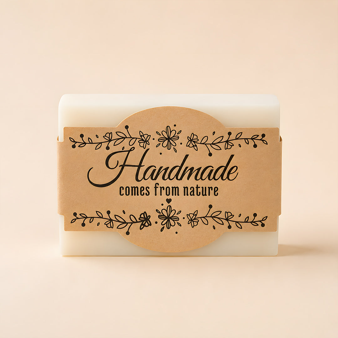 Bar of soap with a 'Handmade comes from nature' label on a beige background
