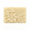 Bar of soap with floral design on a white background